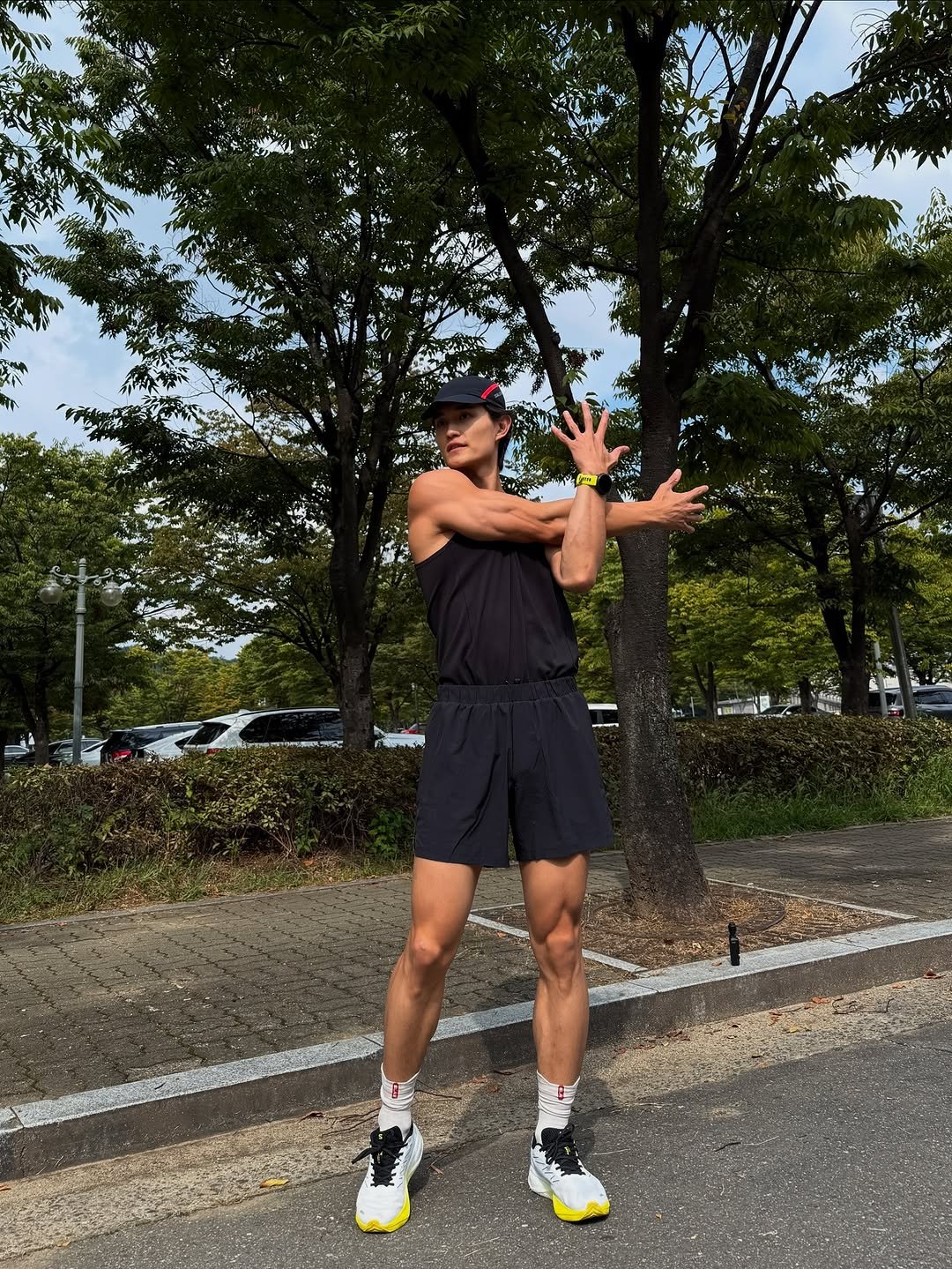 Photo shared by 김승우 🇰🇷 on September 29, 2025 tagging @bsnkorea. May be an image of 1 person, shorts, sportswear, road and text.
