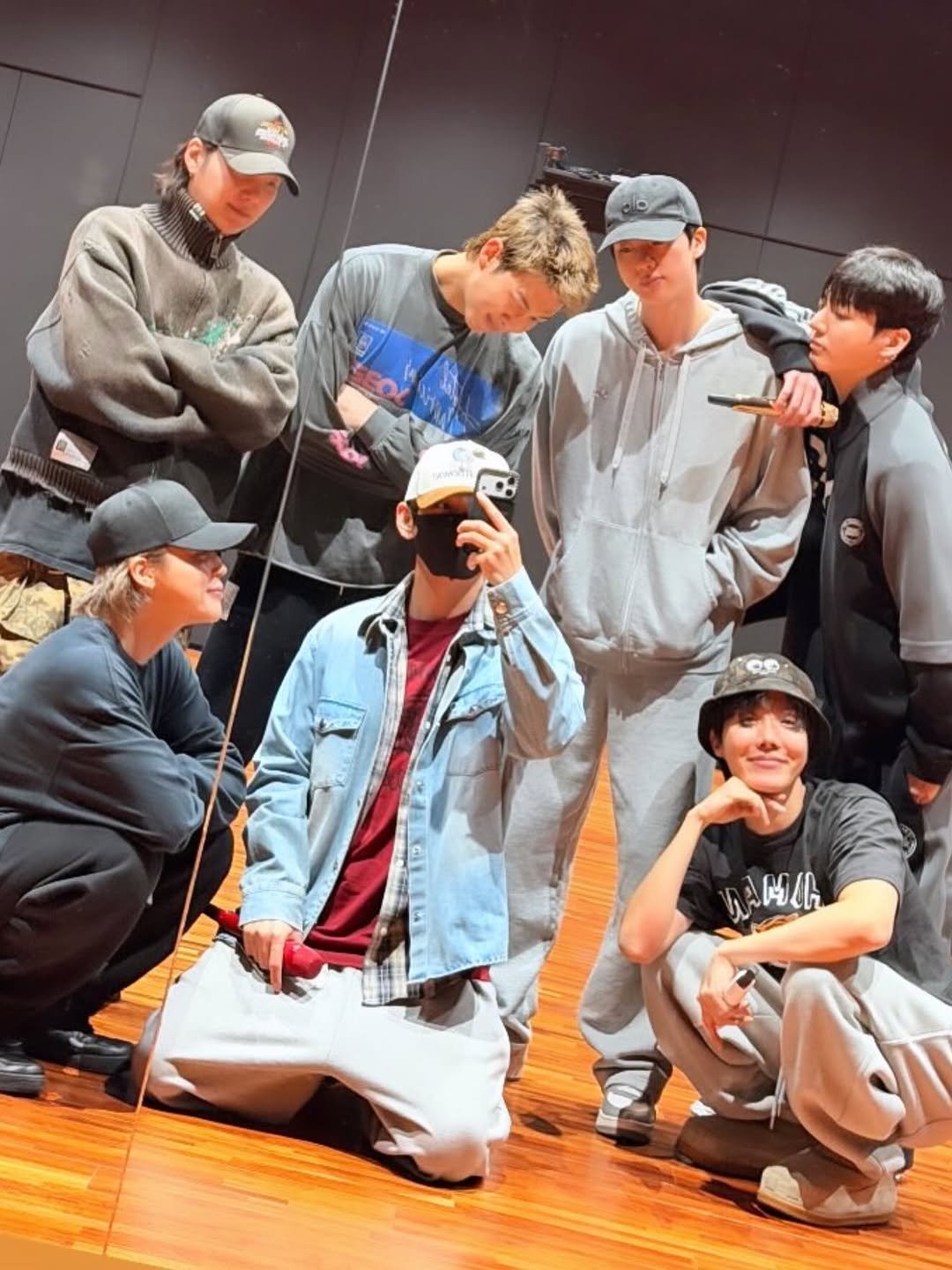 Photo shared by @bts.bighitoffilcial on December 12, 2025 tagging @bts.bighitsofffcial, @bts.bighlitofficial, @bts.bighitmusic, and @bts.bighitoffficiai. May be an image of one or more people, bangs, sweatpants and text.