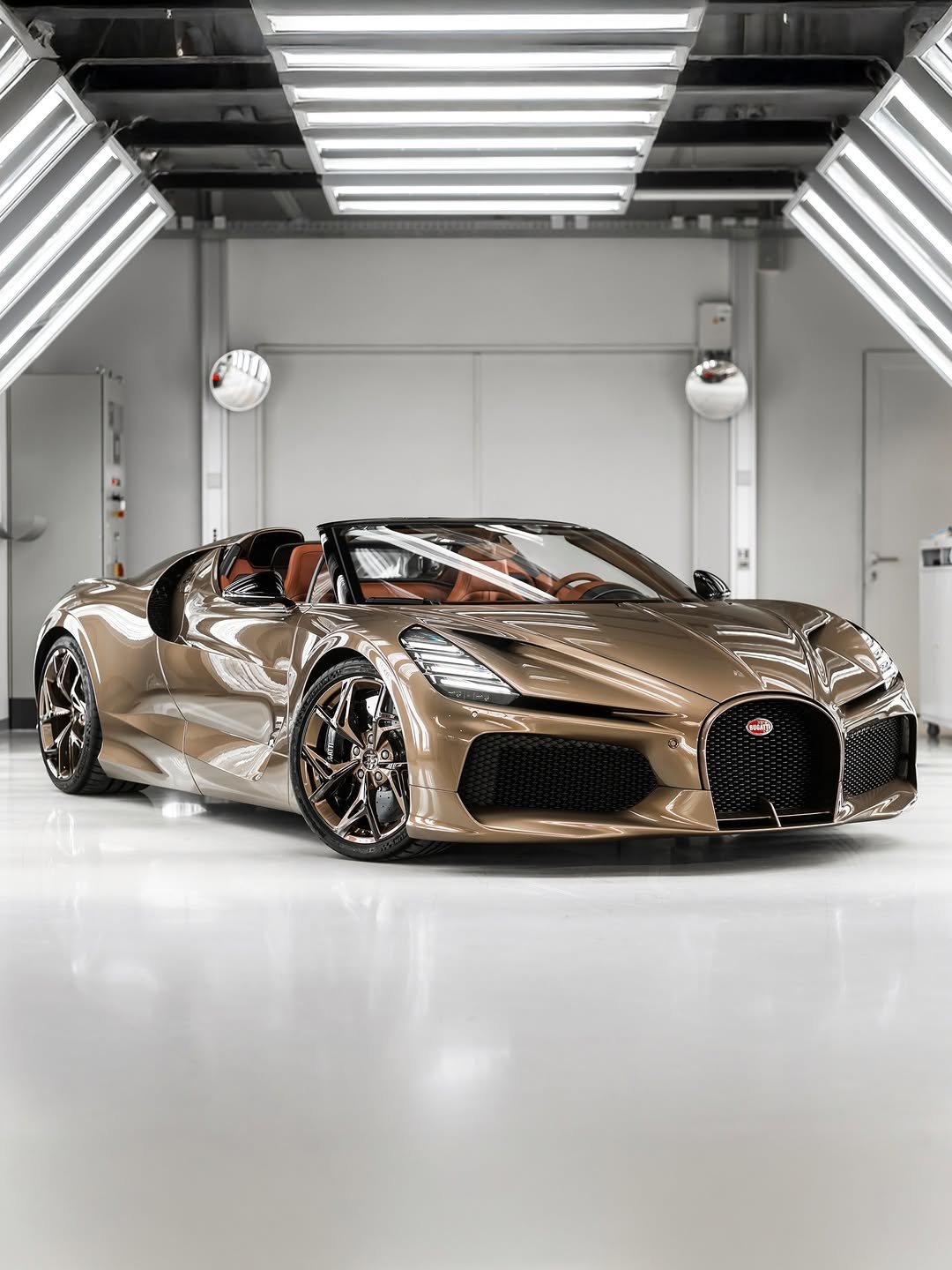 Photo shared by BUGATTI on February 08, 2026 tagging @bugatti.uae. May be an image of race car, wheel, roadster and text.