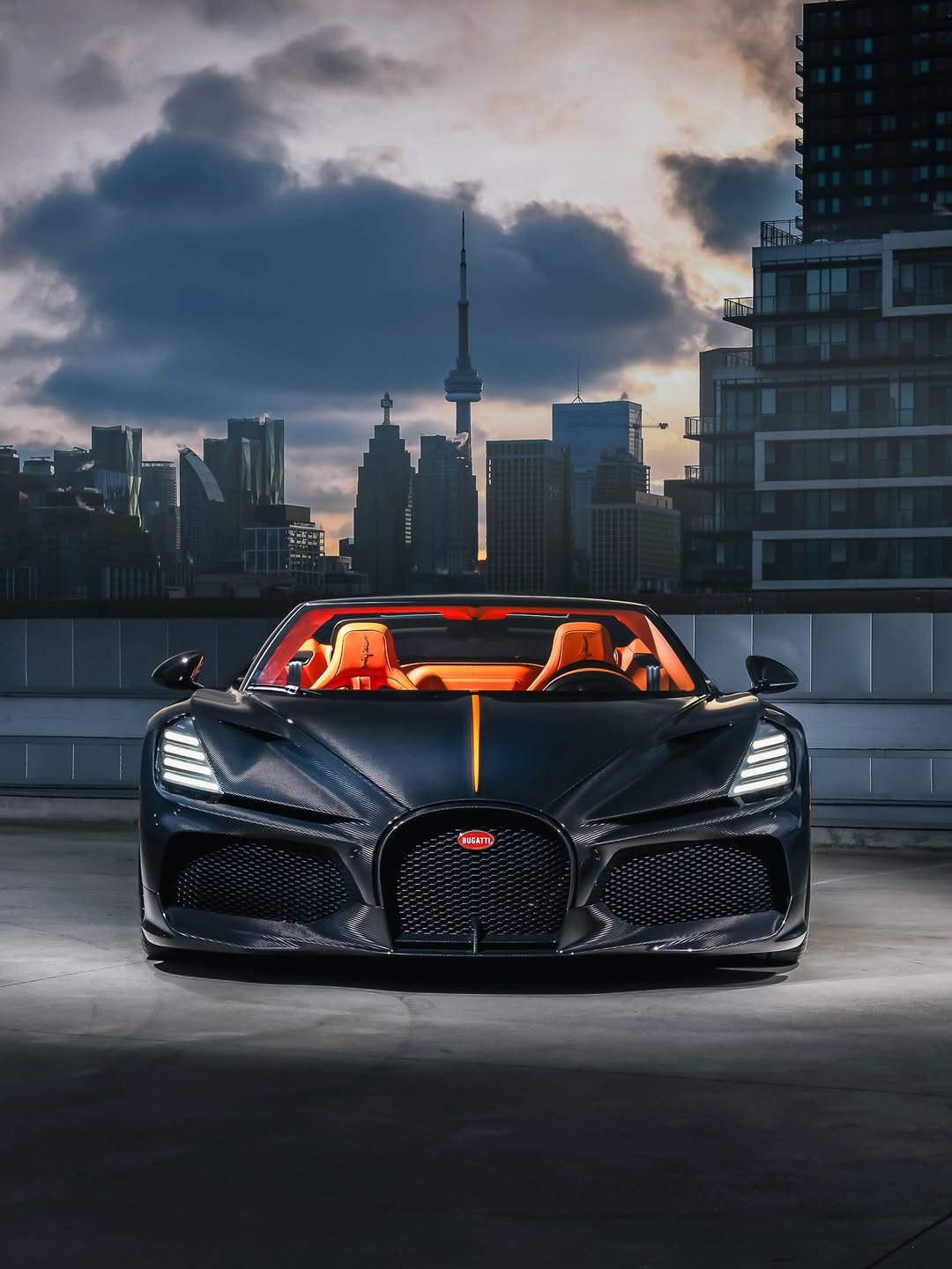 Photo shared by BUGATTI on February 11, 2026 tagging @bugattitoronto. May be an image of car, roadster, wheel, road and text.