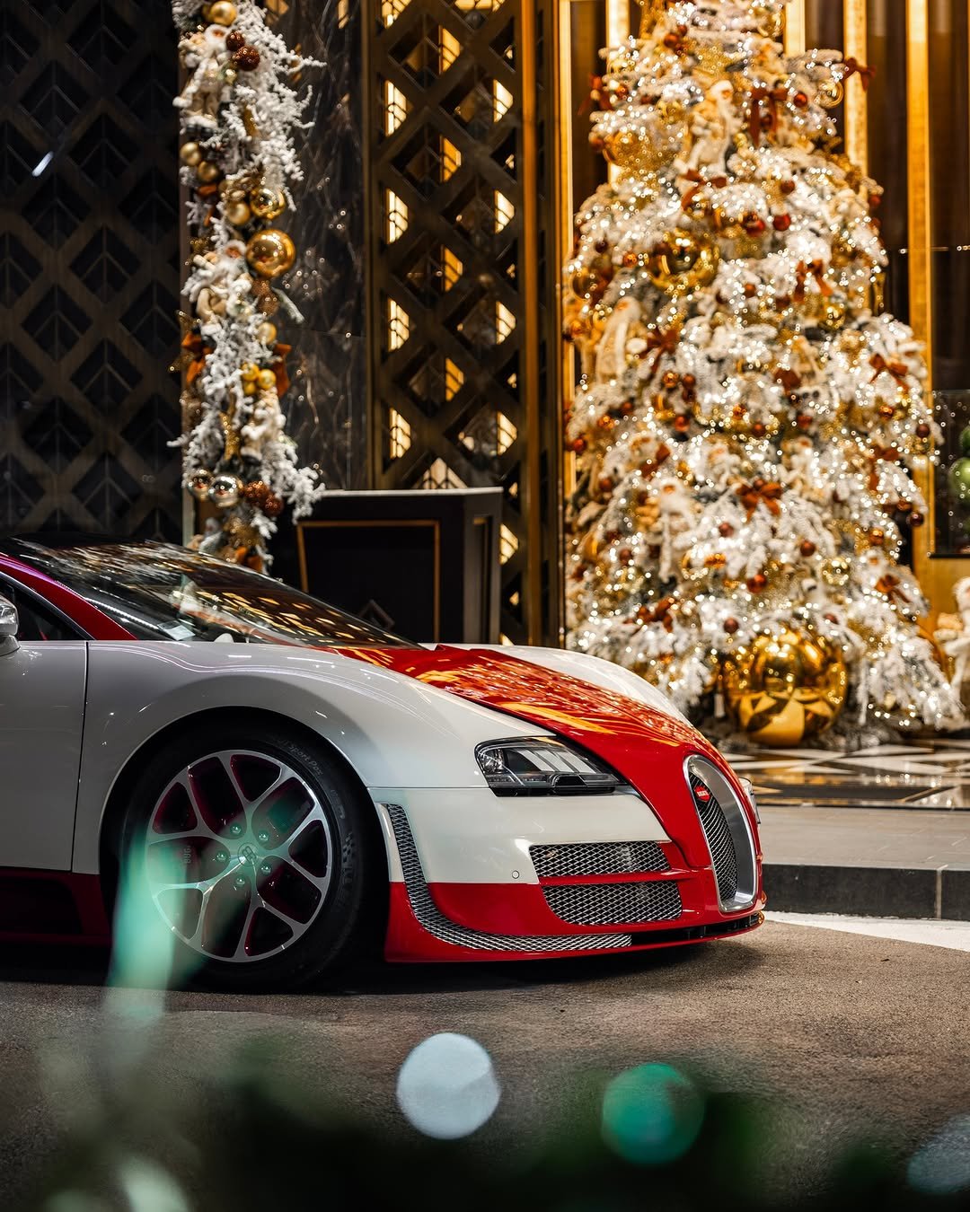 Photo by BUGATTI on December 30, 2025. May be an image of christmas tree, race car, wheel, road and text.