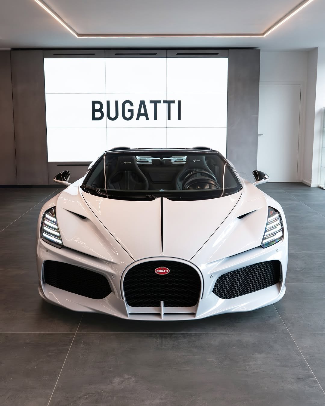 Photo shared by BUGATTI on December 16, 2025 tagging @mj_photographyhh, and @bugattihamburg. May be an image of race car, wheel, roadster, convertible and text that says 'BUGATTI'.