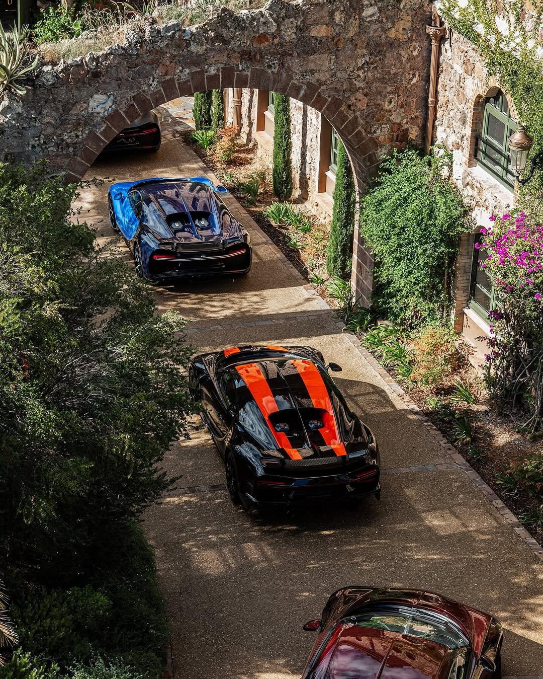 Photo shared by BUGATTI on November 08, 2025 tagging @bugattimonaco. May be an image of blower, race car, roadster and text.