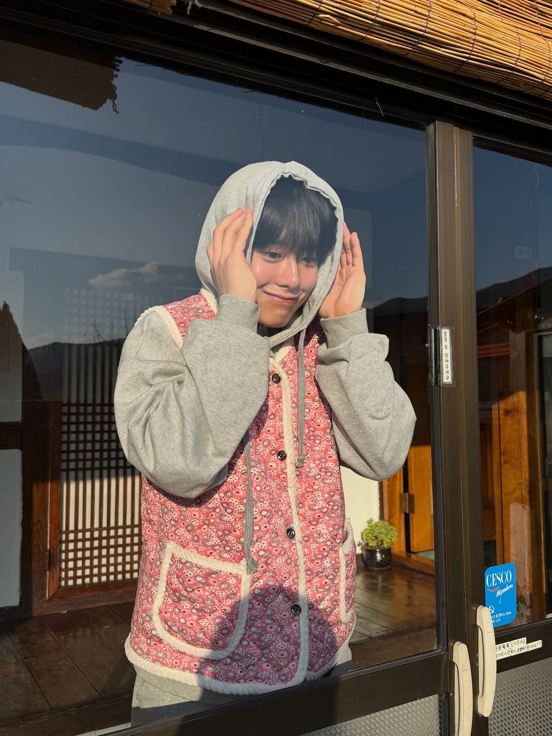 Photo shared by 조잽미 on January 22, 2026 tagging @halmuni_house. May be an image of duffle coat, bath robe, parka, beret and text.