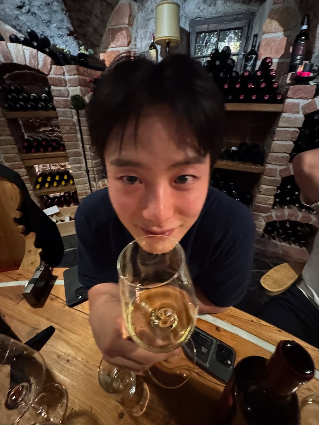 Photo by 조잽미 on July 27, 2025. May be an image of 1 person, wine, wine glass and text.