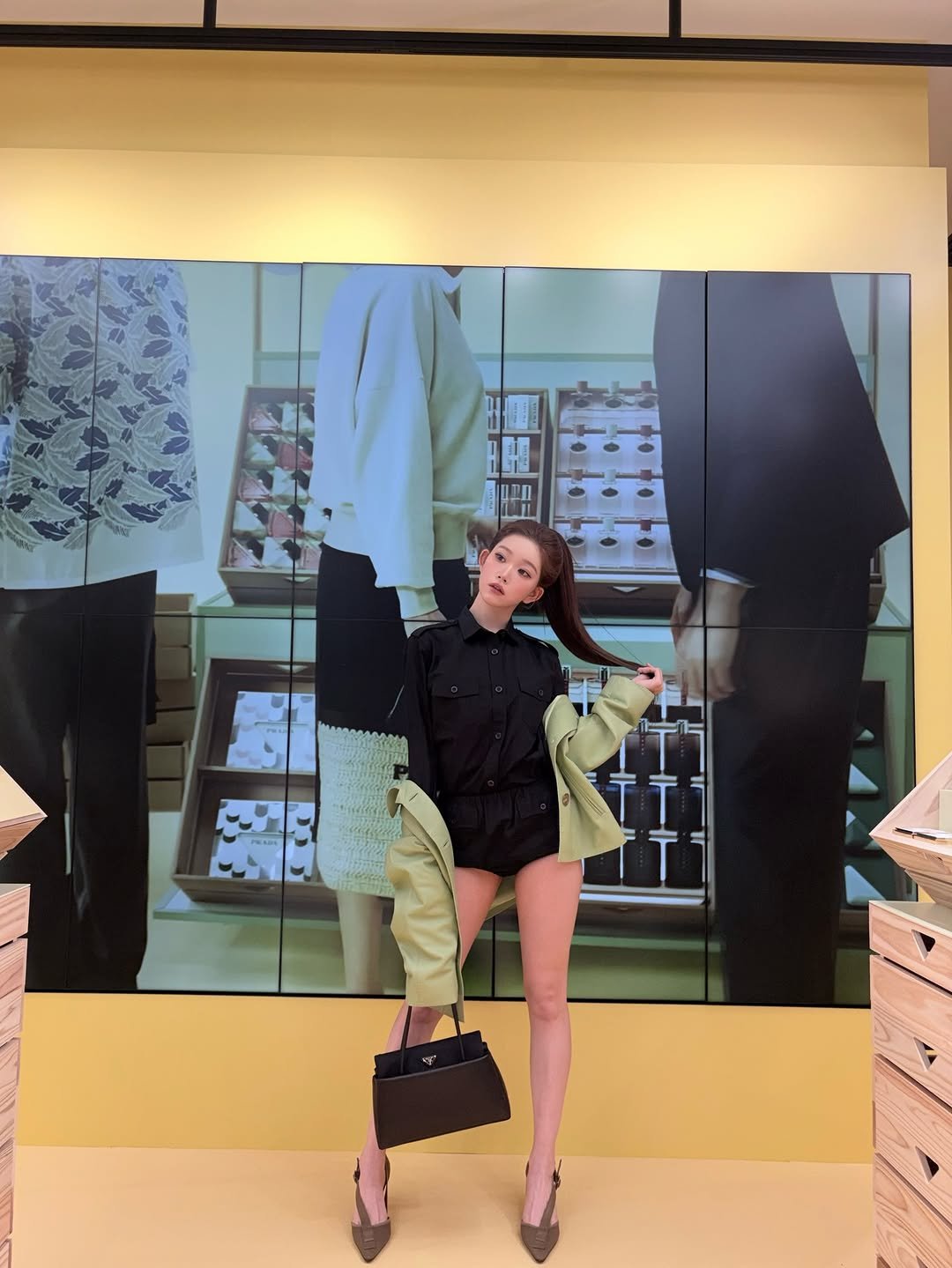 Photo by 츠키 TSUKI on March 26, 2026. May be an image of outerwear, slingback shoes, display case, miniskirt and text.