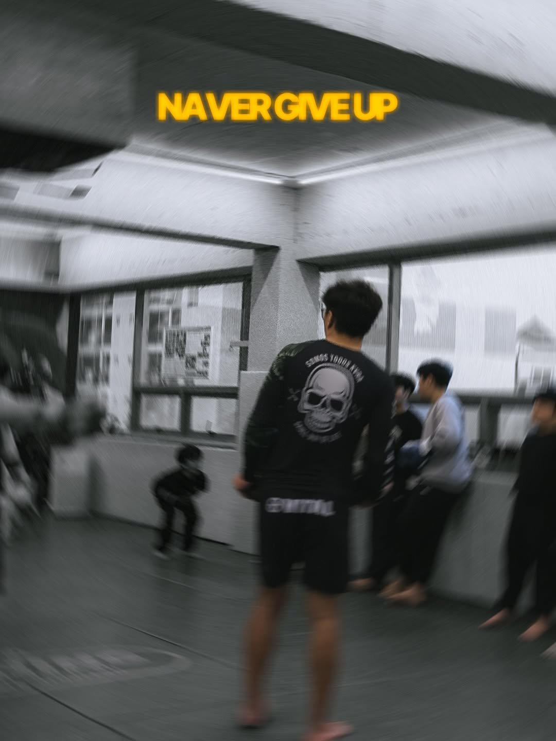 Photo shared by 버닝주짓수 on January 14, 2026 tagging @overlimit_gumi_burning. May be an image of martial arts, belt and text that says 'NAVER NAVERGIVEUP GIVEUP 000'.