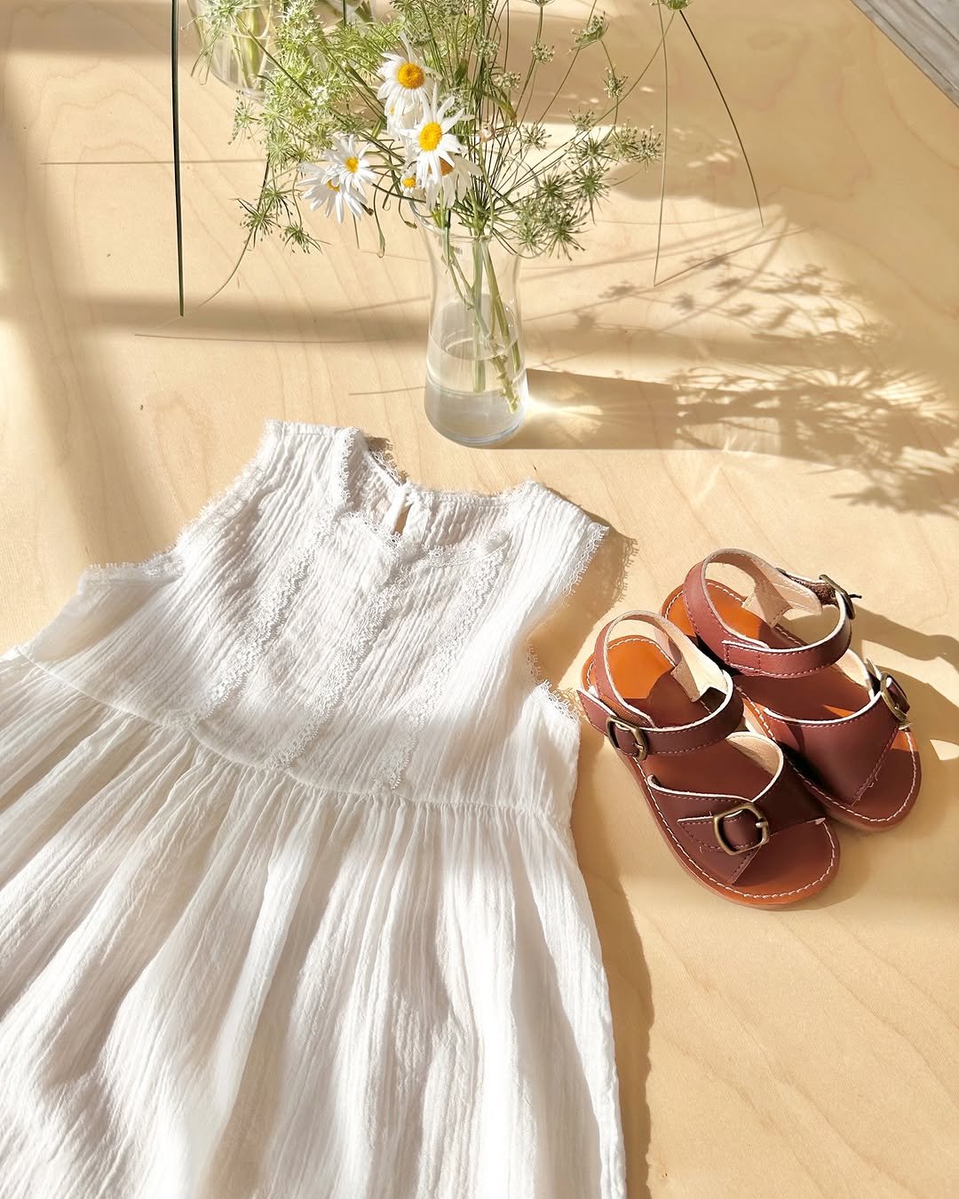 Photo by 버터베베 Do eunbi on May 22, 2025. May be an image of baby shoes, sandals, dress and sundress.