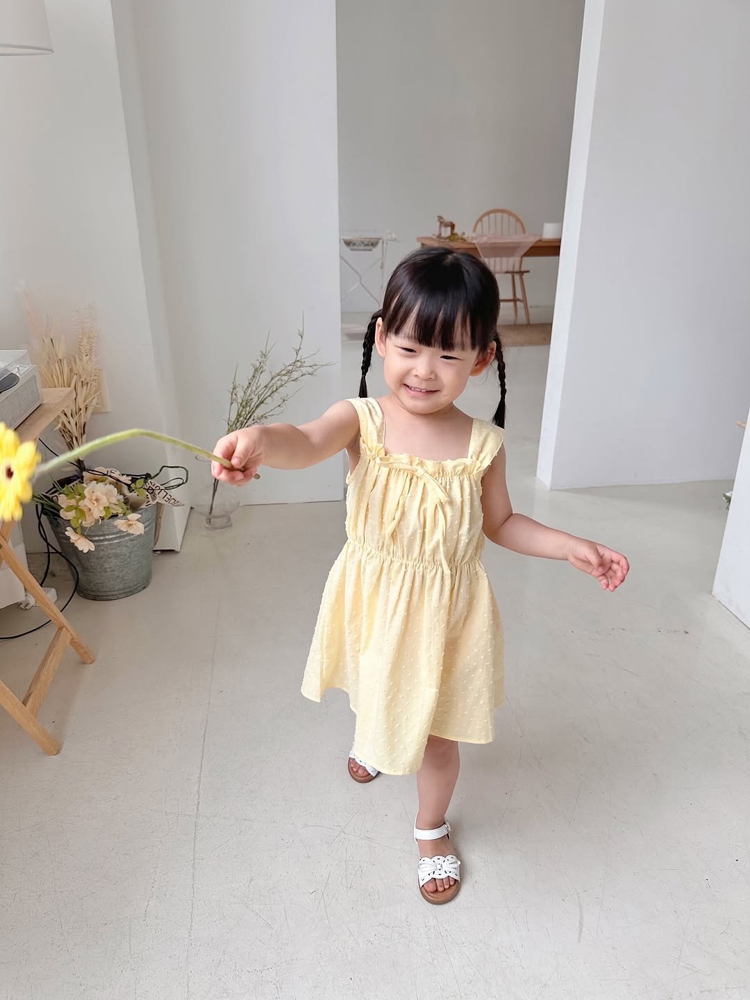 Photo by 버터베베 Do eunbi on June 11, 2025. May be an image of baby, dress, sundress, flower and text.