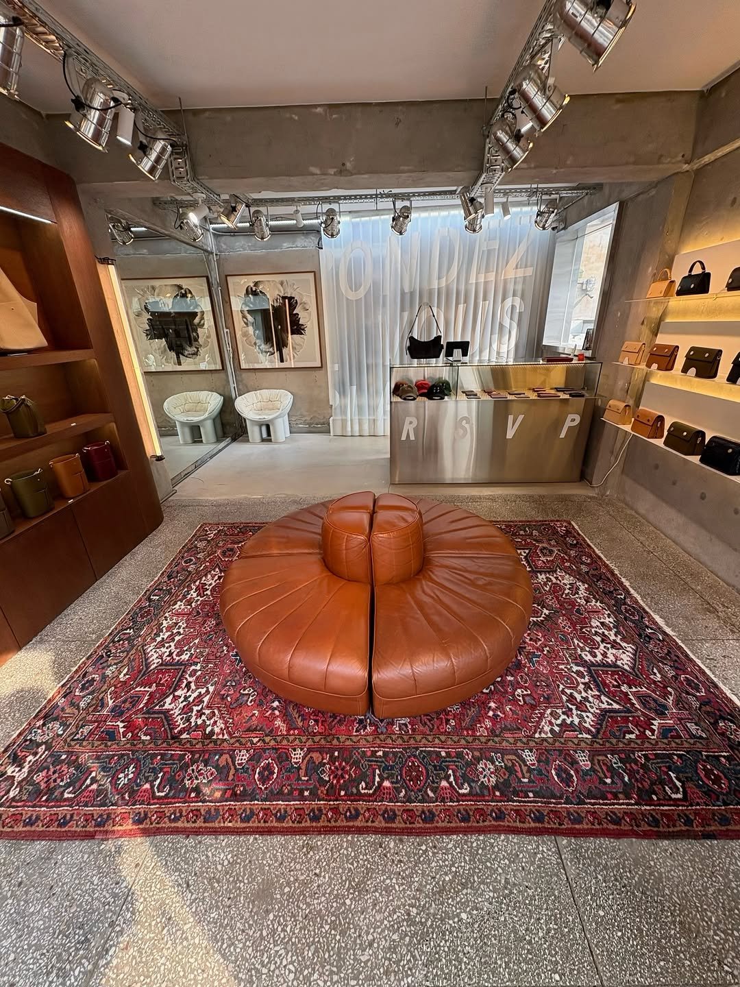Photo shared by 배지연 on November 28, 2025 tagging @rsvp_paris. May be an image of leather, beanbag chair, display case, ottoman, chaise lounge, carpet, indoors and text.