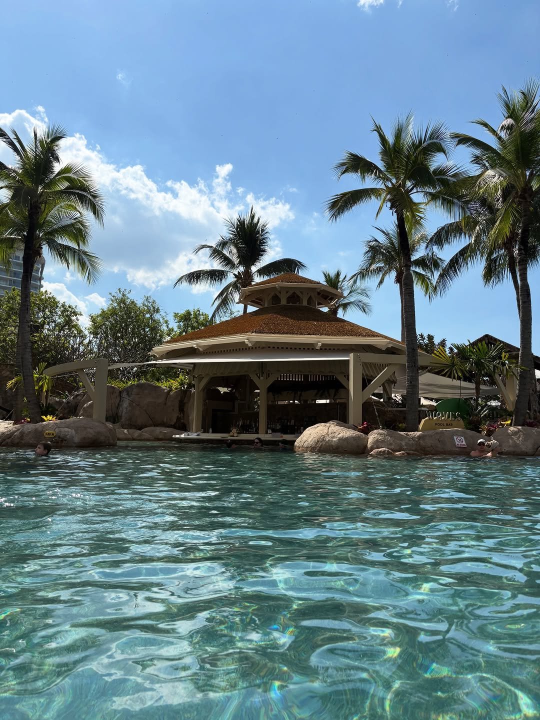 Photo by 배지연 on December 21, 2025. May be an image of swimming, pool, fountain, cabana, palm trees and text.