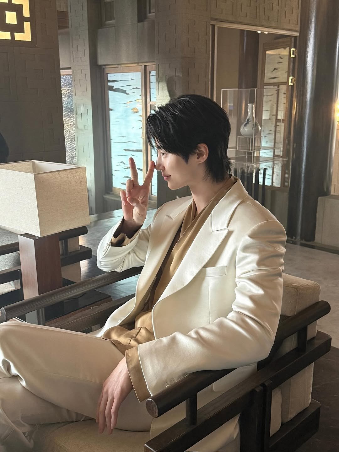 Photo by 변우석  Woo Seok Byeon on October 05, 2025. May be an image of one or more people, hair, suit, bolo tie and blazer.