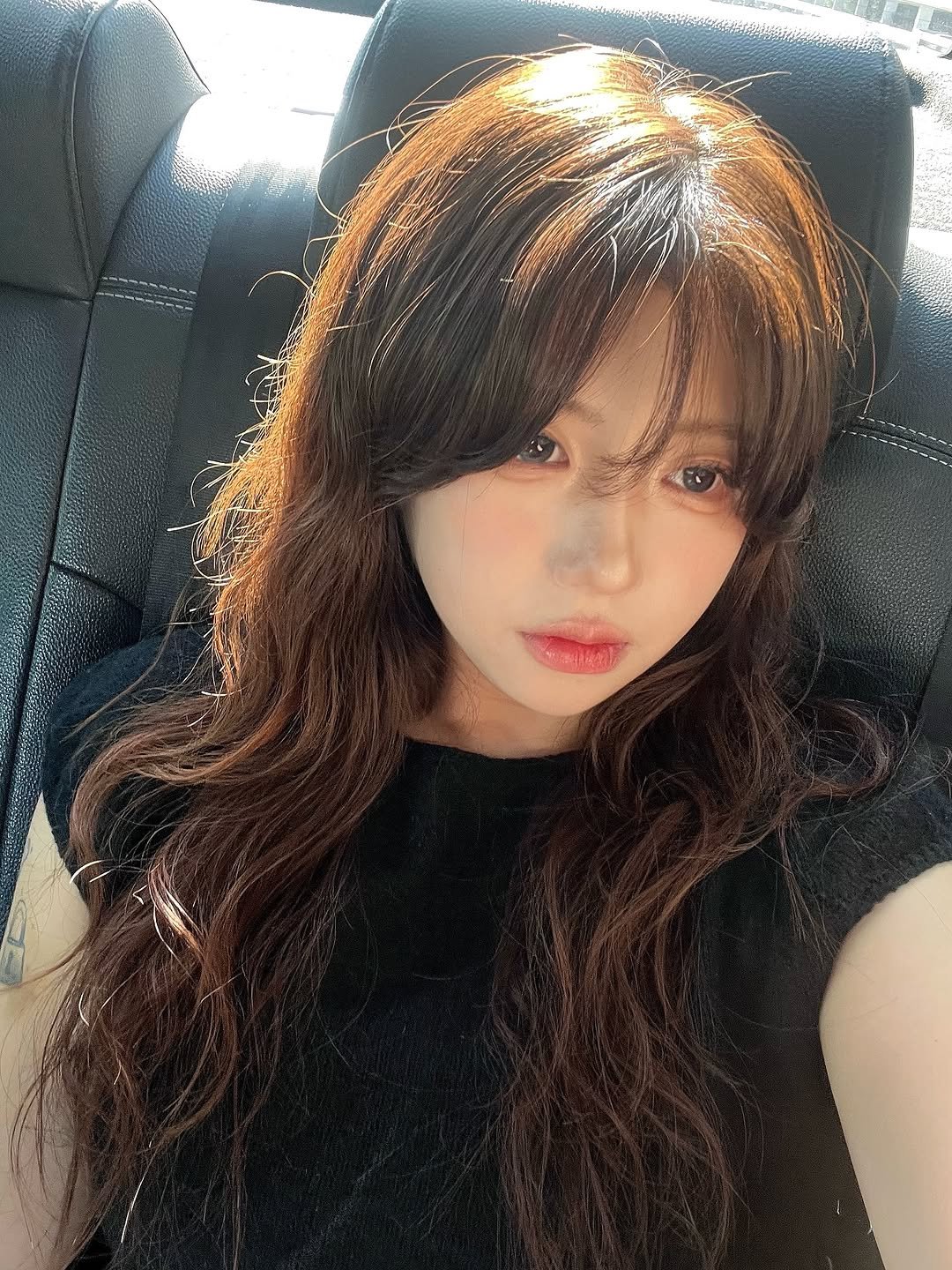 Photo by 송별아 • Byulla on September 14, 2025. May be an image of 1 person, bangs, long hair, bus and text.
