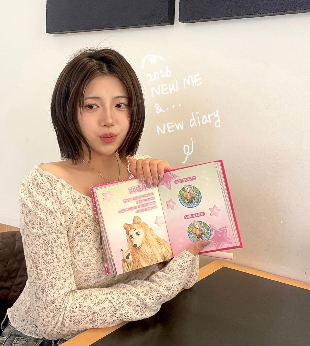 Photo by 송별아 • Byulla on January 17, 2026. May be an image of one or more people, hair, diary, book, magazine, top and text.