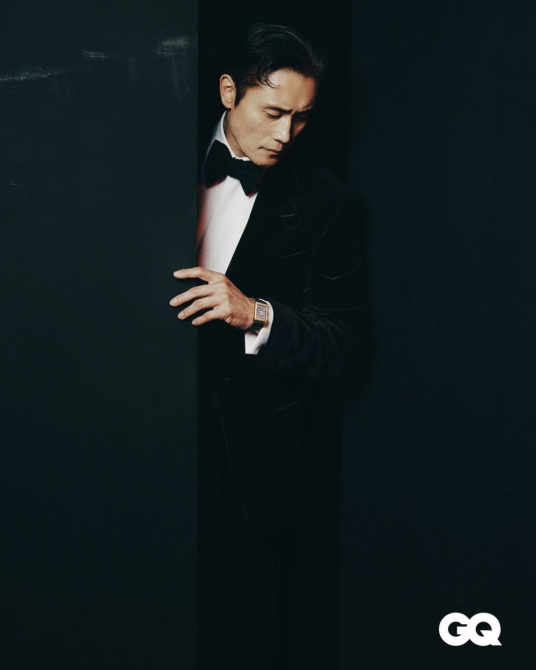 Photo by LeeByungHun 이병헌 on November 11, 2025. May be an image of suit, magazine, blazer, bowtie, dinner jacket, poster and text that says 'GQ'.