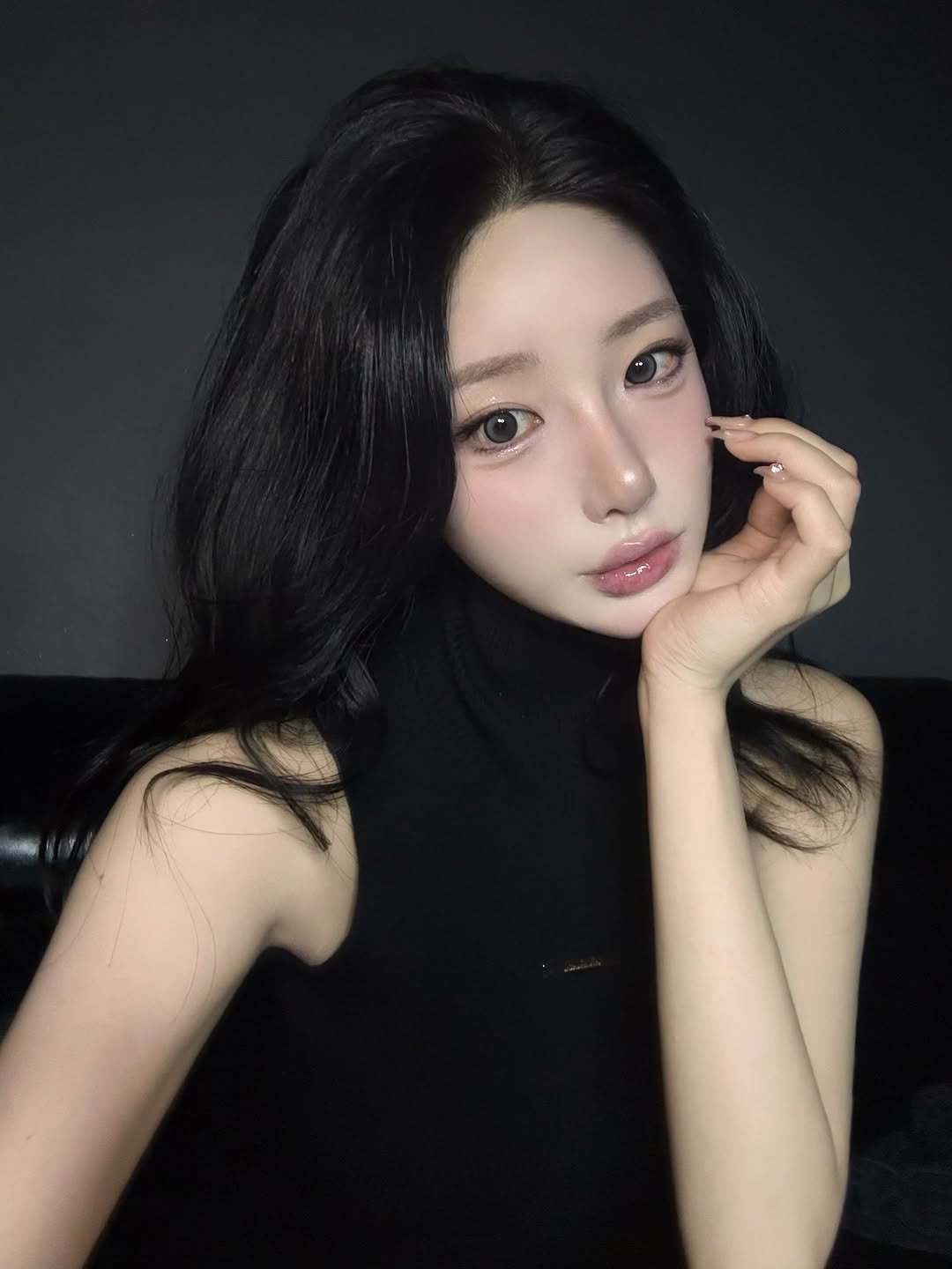 Photo by 최유리 Choi Yuri on January 14, 2026. May be an image of one or more people, makeup, hair, turtleneck and text.