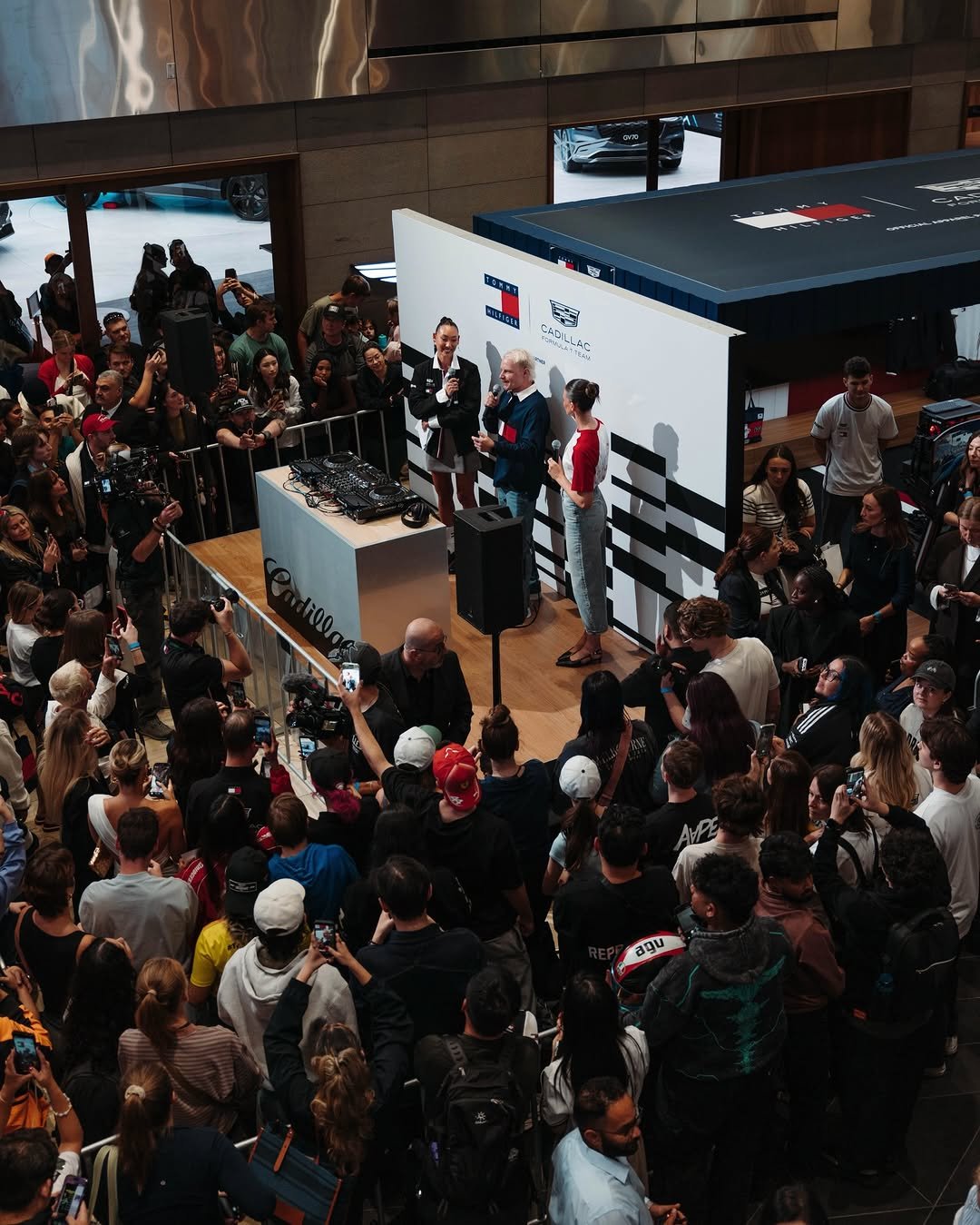 Photo shared by Cadillac Formula 1 Team on March 04, 2026 tagging @tommyhilfiger, and @valtteribottas. May be an image of crowd and text.