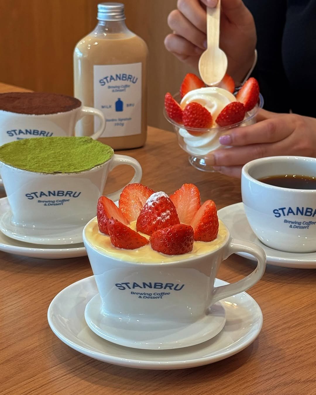 Photo shared by 카페 투어 : 𝚋𝚢 𝙹𝚒𝚖𝚗𝚒 on February 22, 2026 tagging @stanbru_official. May be an image of drink, strawberry, tiramisu, cheesecake and text that says 'STANBRU aDrae ae Sprnd STANBRU STANBRU ne AD Ca Ce: STANB Brewing BrewingCoffee Coffee &Dessert STANBRU Brewing Peuoe Coffee BrewingCoffee'.