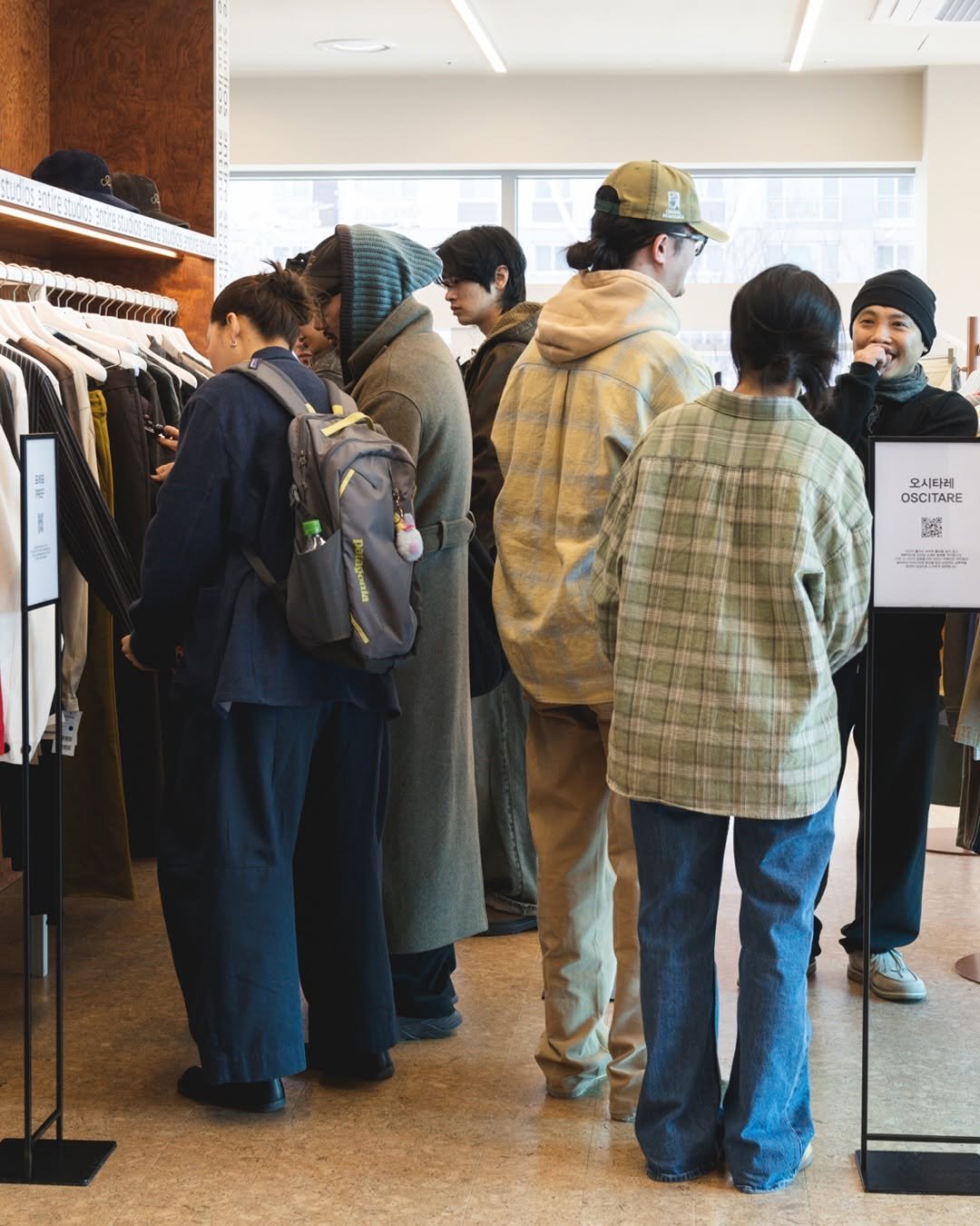 Photo shared by NOCLAIM 노클레임 on February 21, 2026 tagging @carelabeling. May be an image of one or more people, duffle coat, overcoat, parka and text.