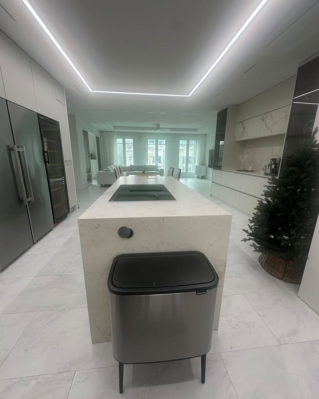 Photo by 까사림 (hyerim ku) on May 12, 2025. May be an image of kitchen island, range hood, lighting, countertop, indoors, kitchen and text.