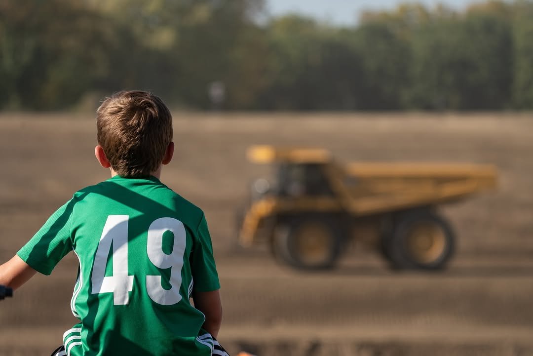 Photo by Cat Mining on February 14, 2026. May be an image of child, football, soccer, combine, lawnmower, tractor, grass and text.
