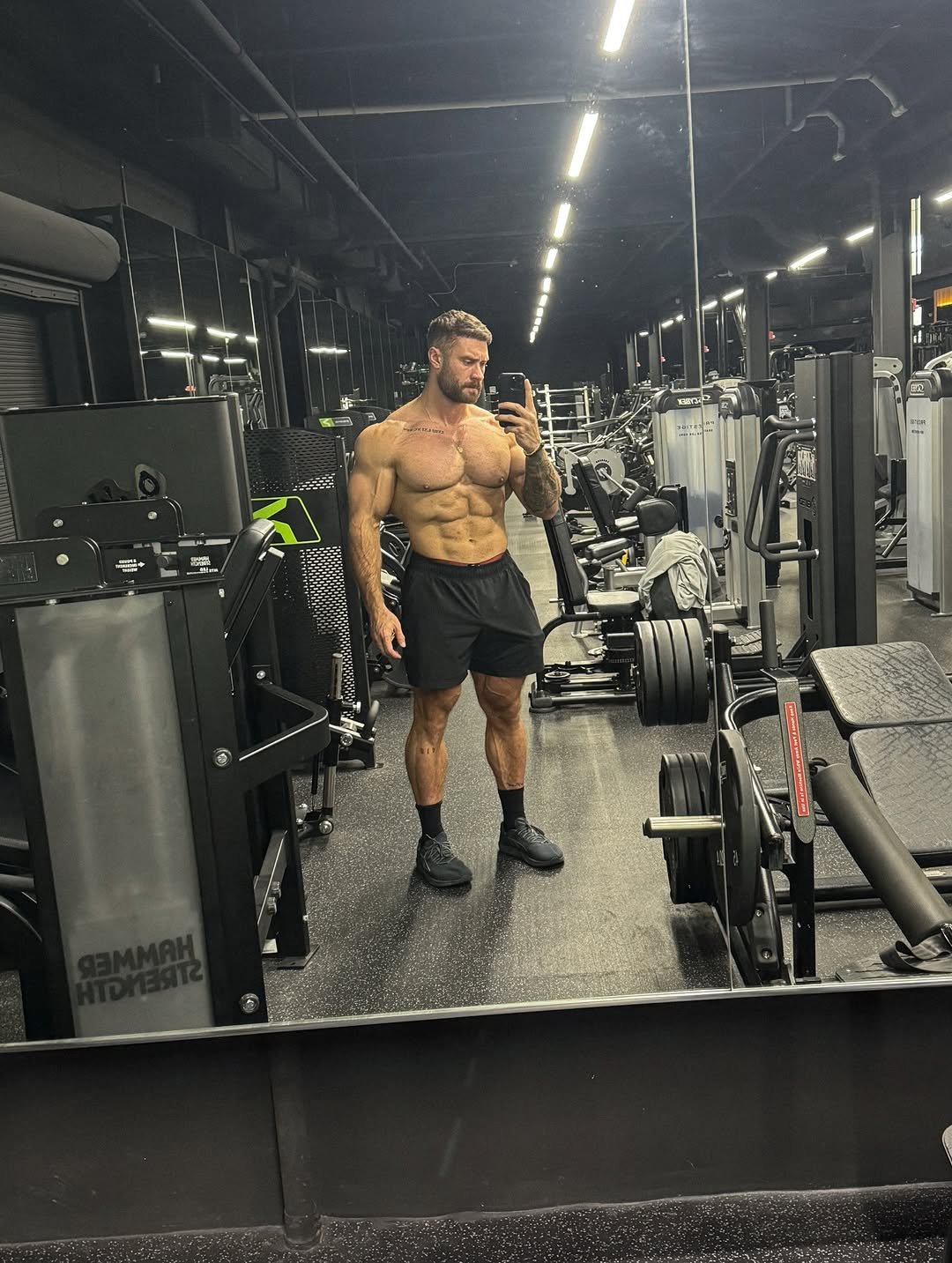 Photo shared by Chris Bumstead on January 03, 2026 tagging @stndrd. May be an image of one or more people, biceps, people bodybuilding, barbell and text.