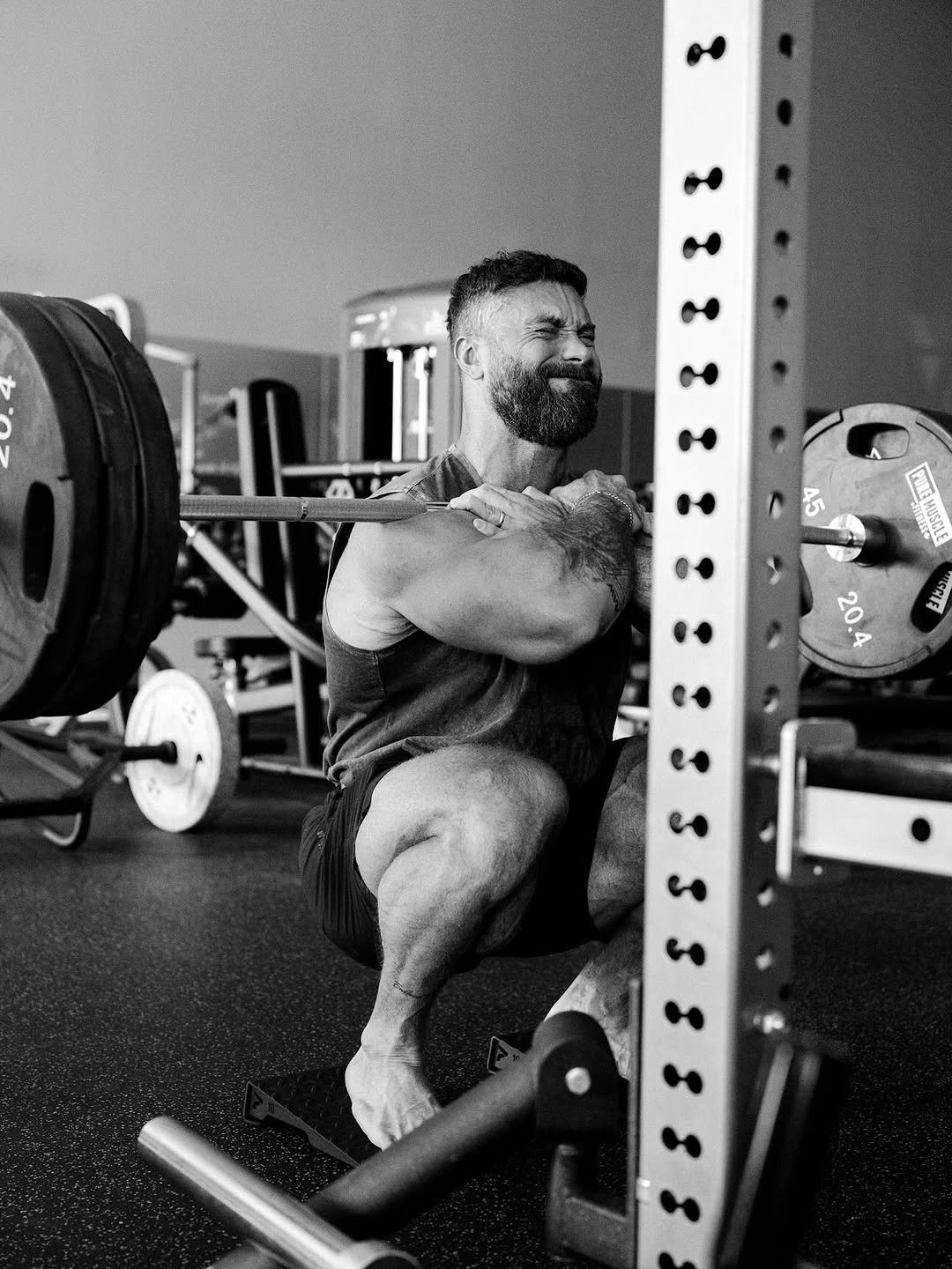 Photo shared by Chris Bumstead on November 04, 2025 tagging @karlykreative. May be an image of one or more people, beard, biceps, people bodybuilding, barbell and text.