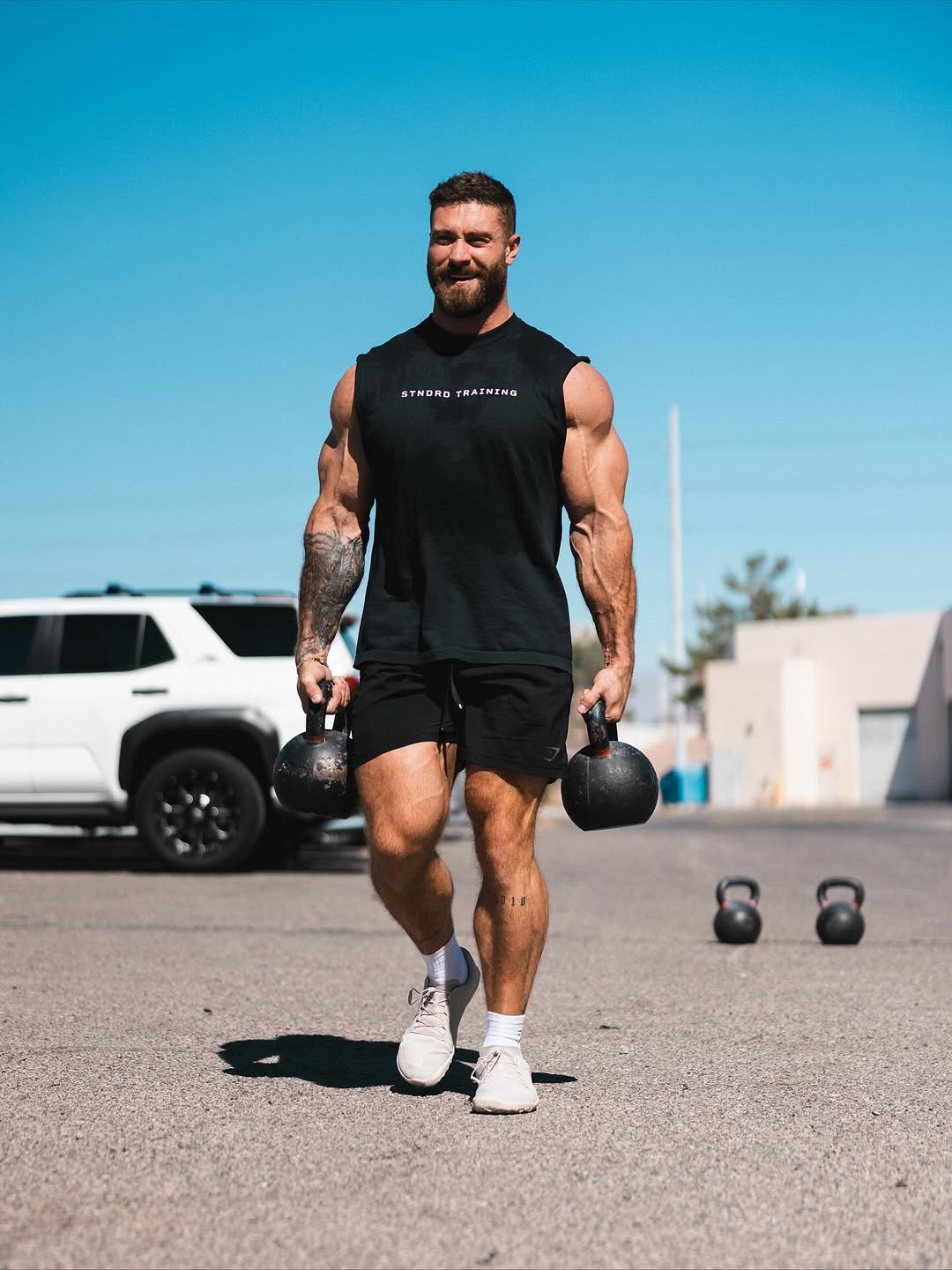 Photo shared by Chris Bumstead on November 02, 2025 tagging @stndrd, and @karlykreative. May be an image of one or more people, beard, activewear, barbell, sportswear, dumbbell and text.