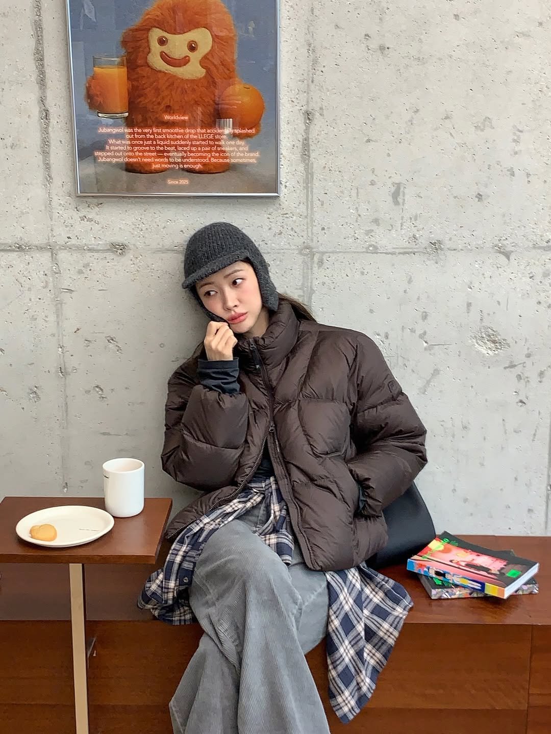 Photo shared by 차정원 on December 04, 2025 tagging @fila_korea. May be an image of bear, duffle coat, overcoat, goosedown coat, parka, sweatpants, face mask, cornflower and text.