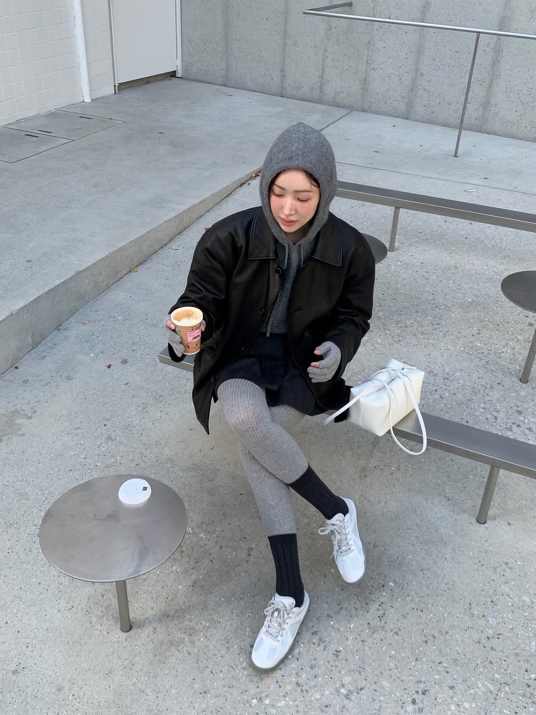 Photo shared by 차정원 on November 27, 2025 tagging @fila_korea. May be an image of overcoat, wingtip shoes, duffle coat, turtleneck, parka, sweatpants, cornflower and text.