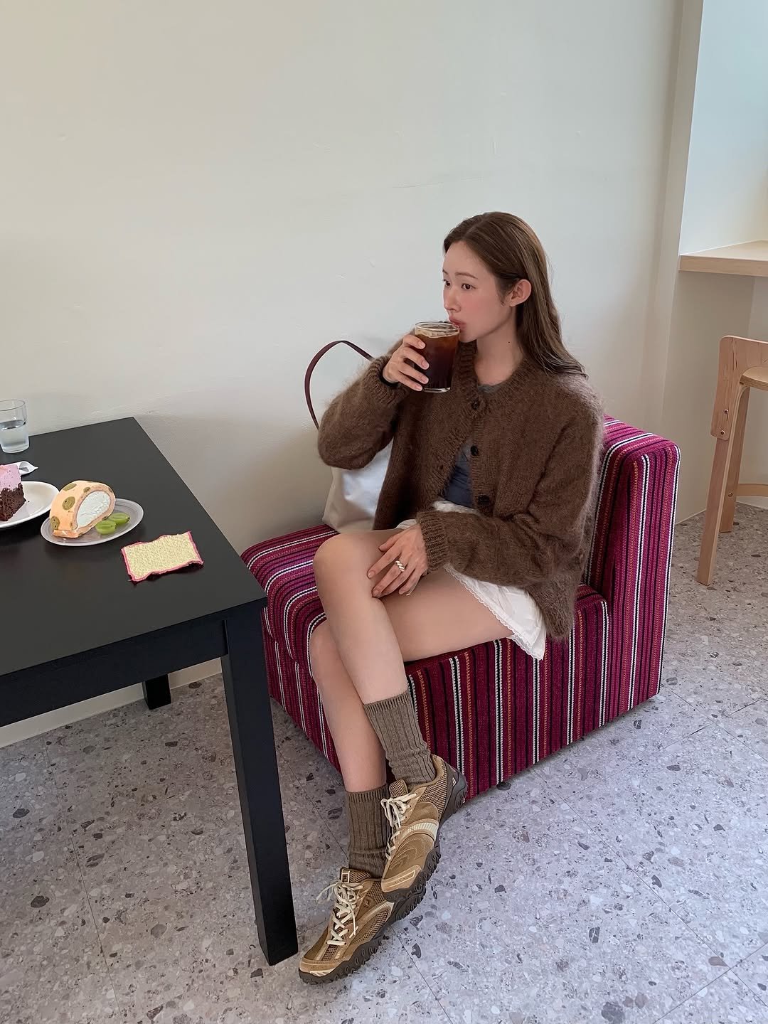 Photo by 차정원 on September 22, 2025. May be an image of 1 person, boots, fur coat and text.