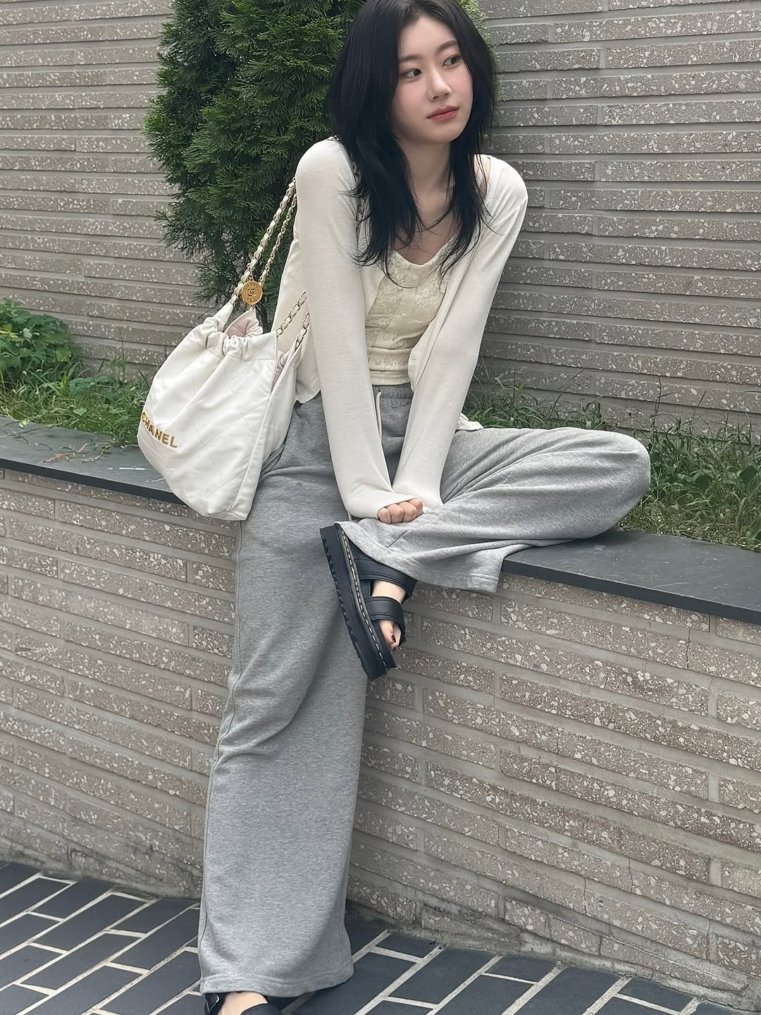 Photo by CHAERYEONG on August 01, 2025. May be an image of one or more people, hair, sleepwear, cardigan, jumpsuit, sweatpants and text.