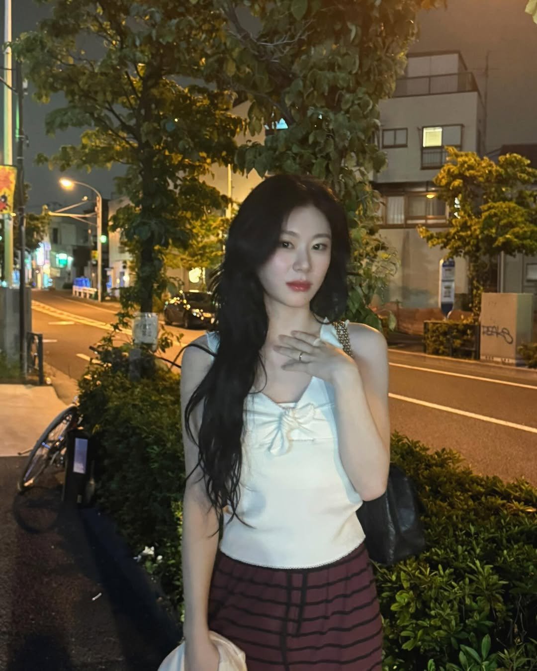 Photo by CHAERYEONG on July 12, 2025. May be an image of one or more people, hair, cigarette, top and night.