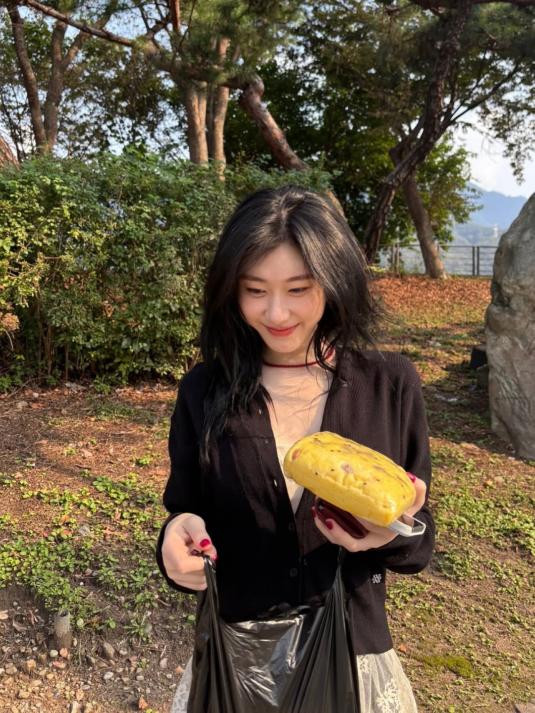 Photo by CHAERYEONG on October 03, 2025. May be an image of 1 person, durian, bread, outdoors and text.