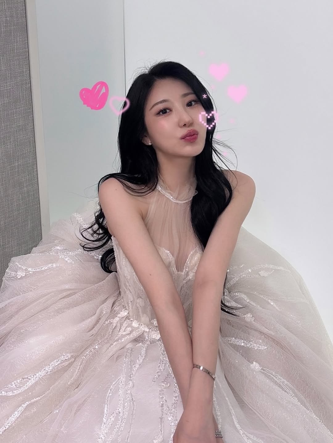 Photo by 이채연 Leechaeyeon on December 30, 2025. May be an image of one or more people, hair, dress and text.