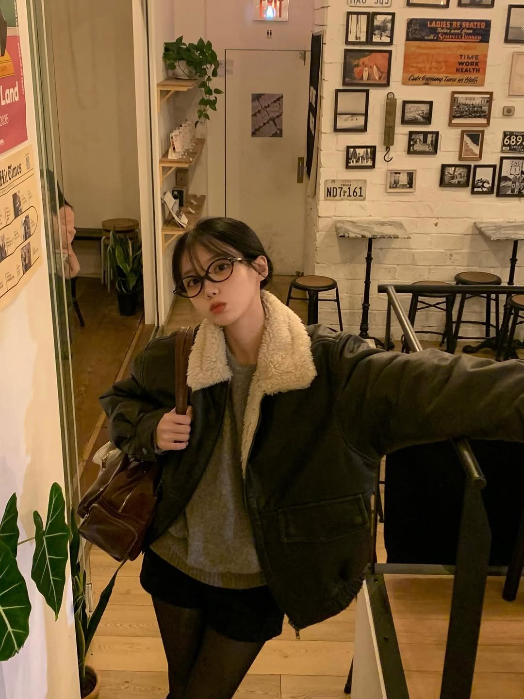 Photo by 차진아 on December 05, 2025. May be an image of one or more people, hair, duffle coat, overcoat, turtleneck, parka, jacket, cornflower and text.