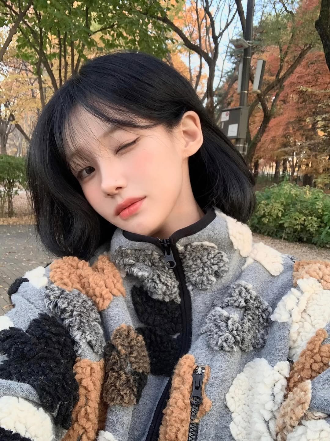 Photo shared by 차진아 on November 27, 2025 tagging @dear.a_kr. May be an image of one or more people, hair, duffle coat, goosedown coat, parka, turtleneck and text.