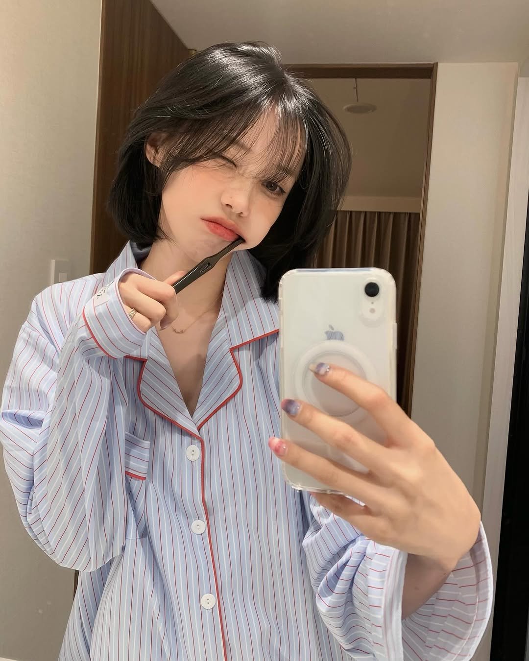 Photo shared by 차진아 on December 17, 2025 tagging @dossy.kr. May be a selfie of one or more people, hair, sleepwear, robe, bath robe and text.
