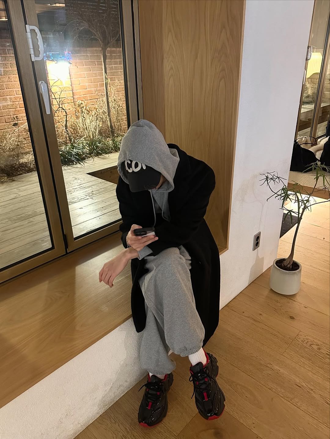 Photo shared by 차강윤 KANG YOON CHA on January 10, 2026 tagging @christianlouboutin. May be an image of face mask, sweatpants, parka, sweatsuit and footwear.