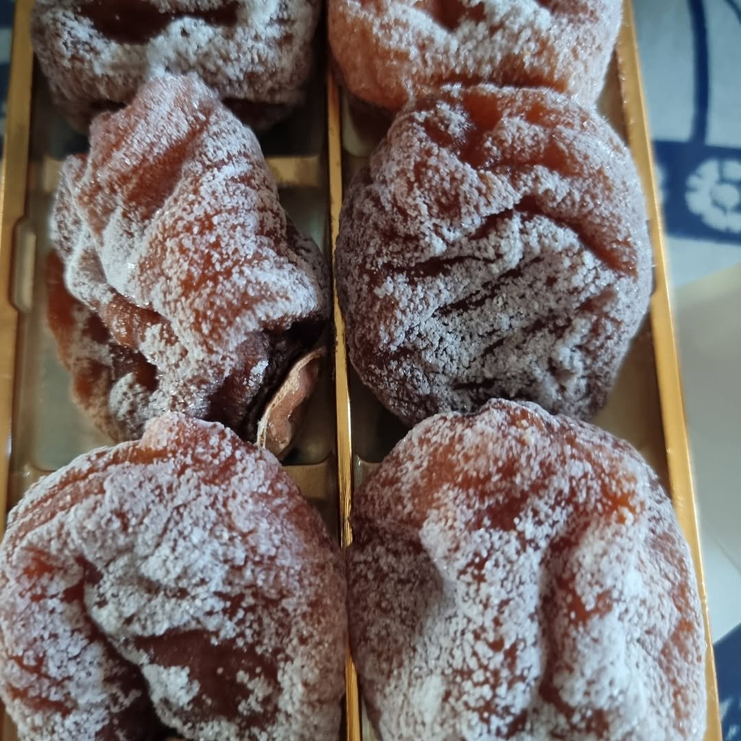 Photo by 찰떡부자 on February 07, 2026. May be an image of fritter, powdered sugar, pastry and text.