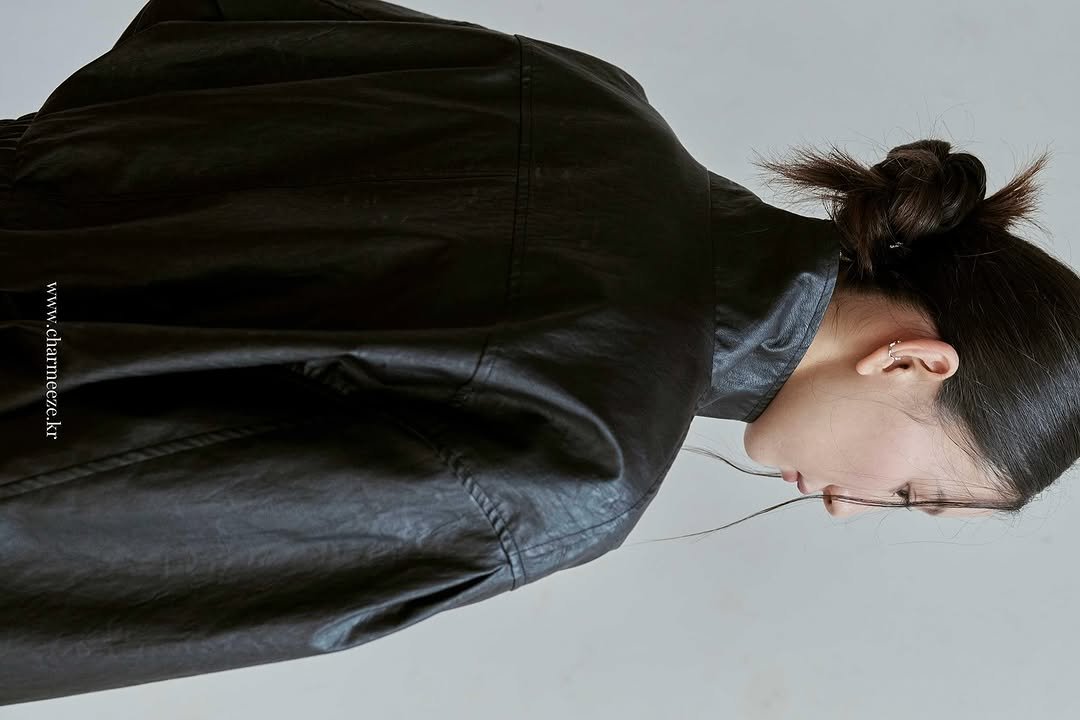 Photo by 차미즈(charmeeze) on August 30, 2025. May be an image of 1 person, leather, jacket and text.