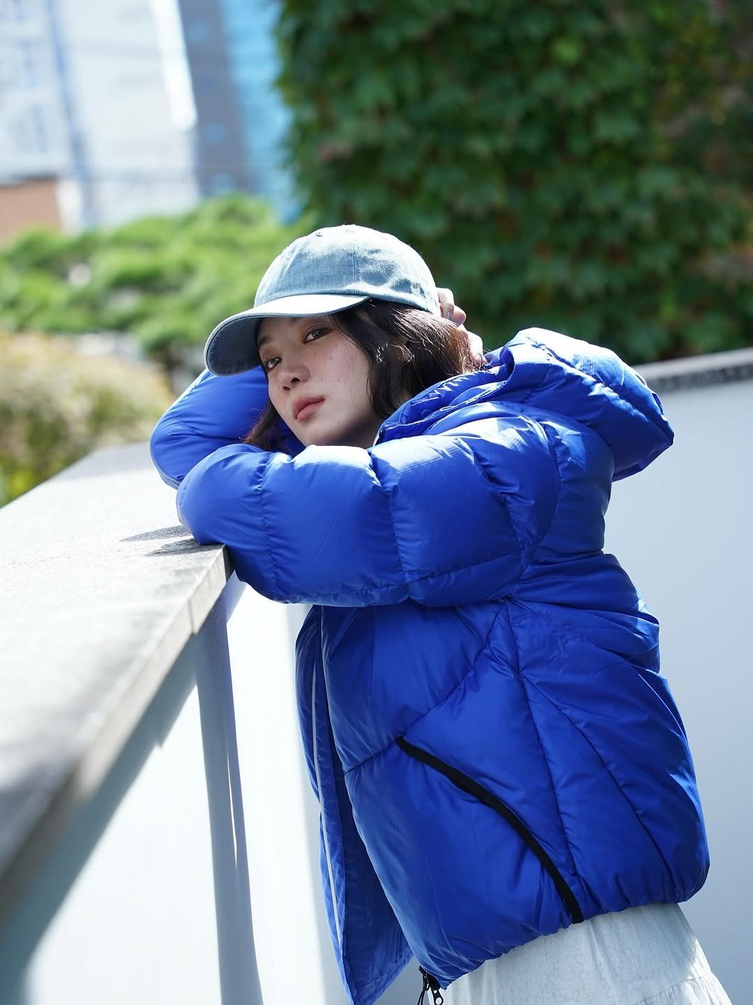 Photo shared by 박주현 on October 21, 2025 tagging @lecoqkorea. May be an image of goosedown coat, hat, duffle coat, jacket, raincoat, parka, outdoors and text.