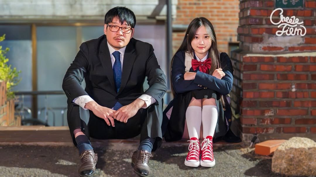 Photo shared by CheezeFilm on March 31, 2026 tagging @zzoo_ccooll, and @dookongc. May be an image of child, duffle coat, suit, brick wall, outdoors and text that says '9% Chese Fiem ፌራሲጵ'.