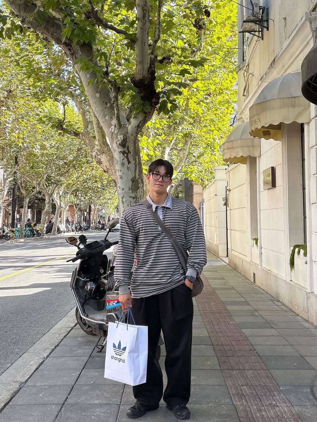 Photo by 최마루 on November 11, 2025. May be an image of overcoat, street and text.