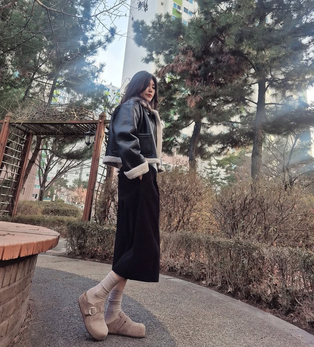 Photo by ♡초코슈슈 on February 16, 2026. May be an image of overcoat, boots and text.