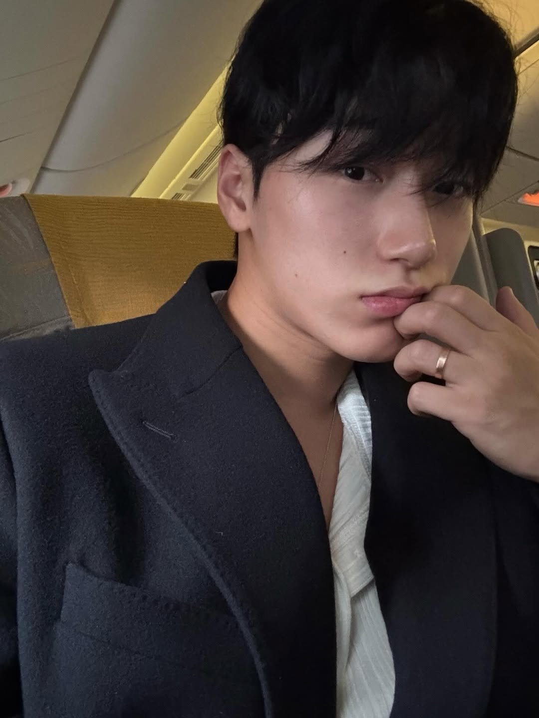 Photo by 산 (SAN) on January 12, 2026. May be an image of one or more people, hair, suit and text.