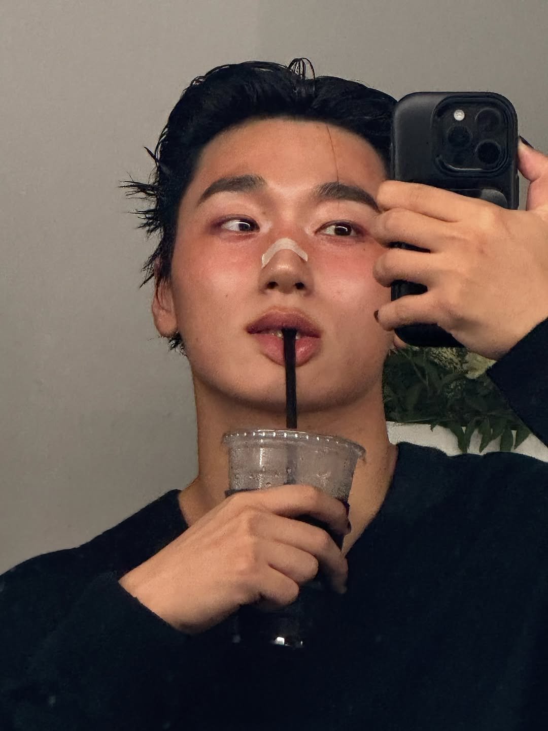 Photo by 산 (SAN) on July 25, 2025. May be a selfie of one or more people, hair, phone, turtleneck, mirror, cornflower and text.