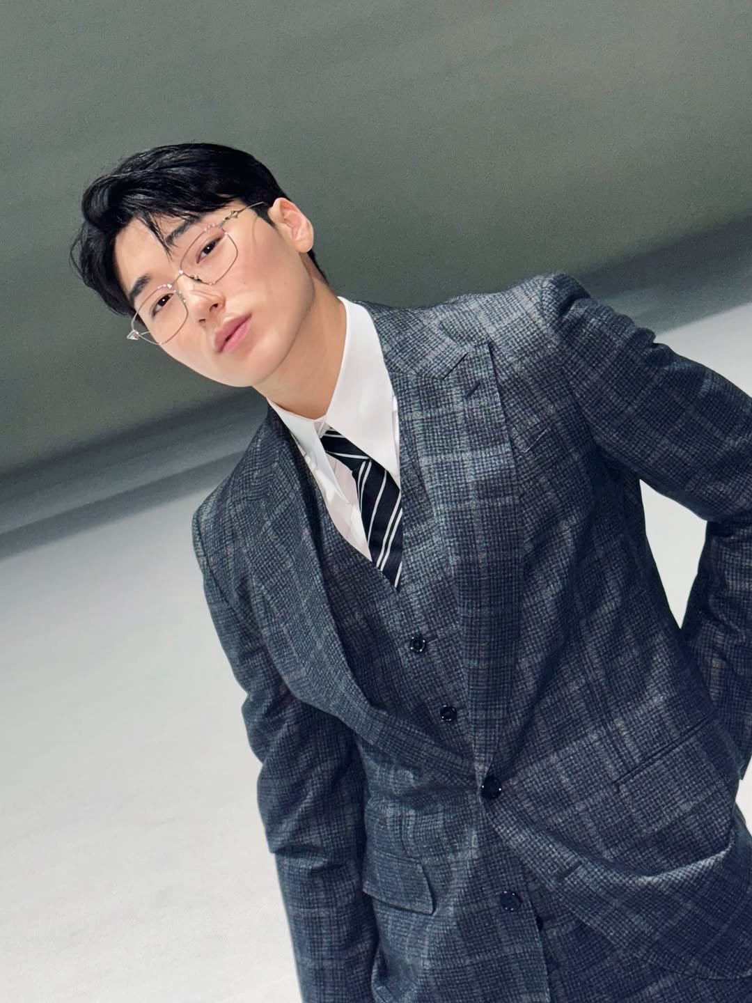 Photo by 산 (SAN) on September 27, 2025. May be an image of 1 person, bolo tie, suit and text.