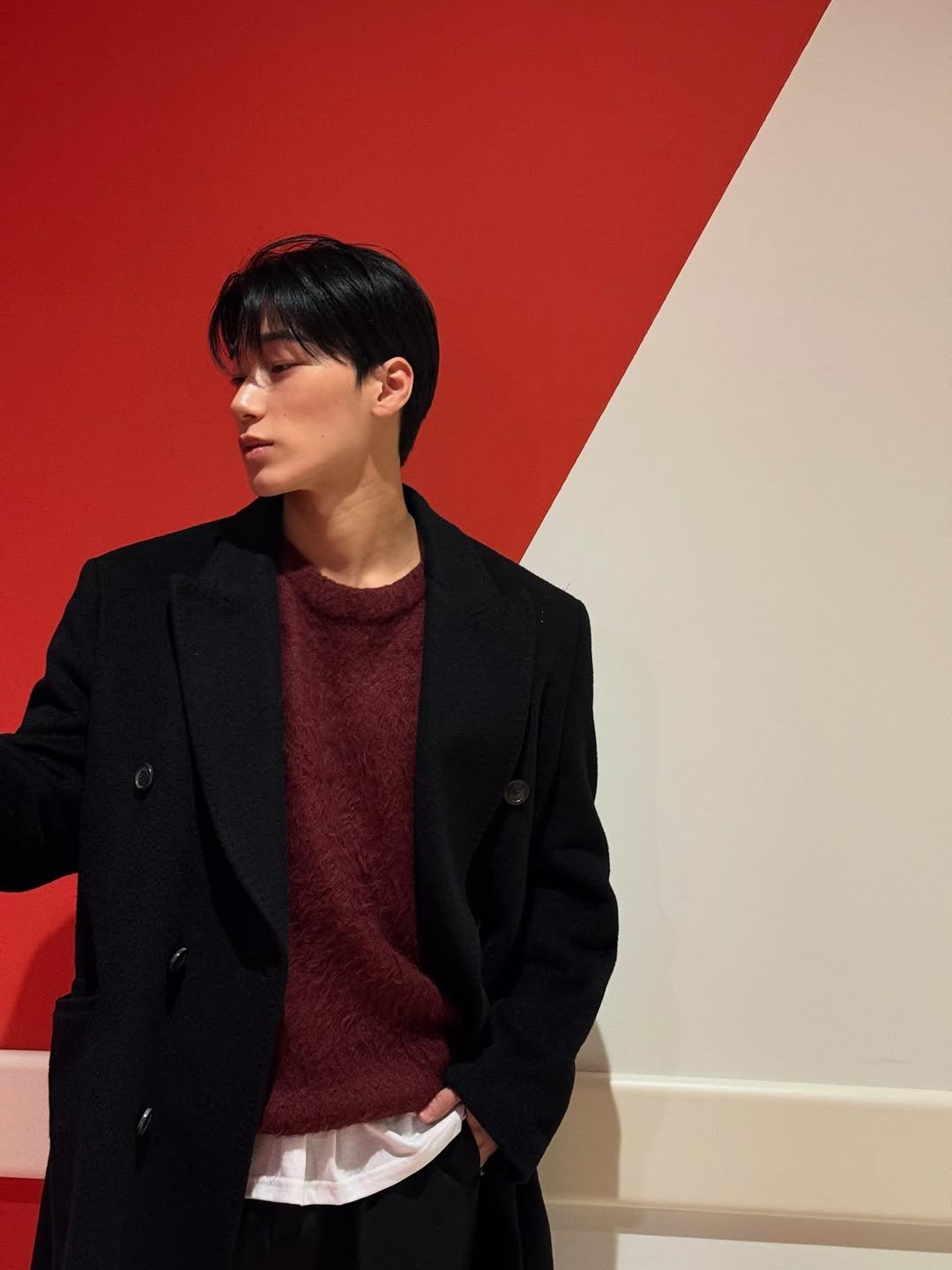 Photo by 산 (SAN) on December 27, 2025. May be an image of one or more people, hair, overcoat, duffle coat, bolo tie, turtleneck and text.