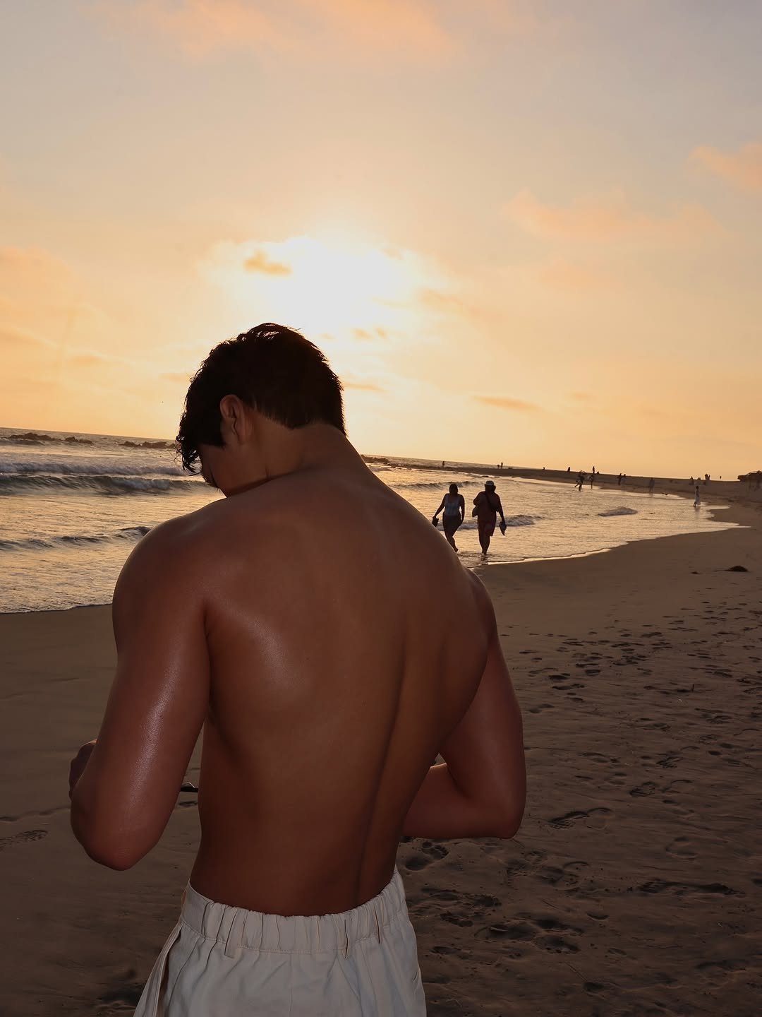 Photo by 산 (SAN) on August 11, 2025. May be an image of 2 people, ocean, beach and text.
